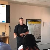 Billy Mac speaking at a community event